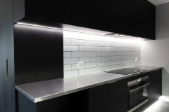 black and stainless kitchen with led lights