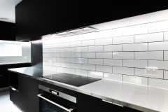 black and stainless kitchen with led lights