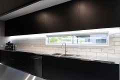 black and stainless kitchen with led lights