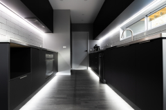 black and stainless kitchen with led lights