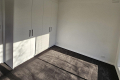 carpet room with cupboards